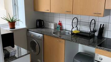 Apartment, 2 Bedrooms | Private kitchen | Oven, stovetop, electric kettle, cookware/dishes/utensils