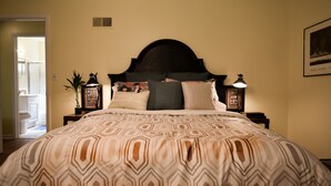 A bedroom with a large bed, a headboard, bedside lamps, and a framed picture on the wall. - SWEET! near Downtown PWR & LIGHT Westport KUMC (Kansas City)