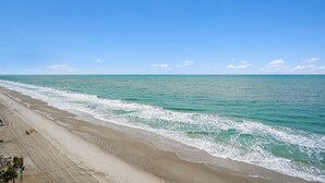 A beach with clear skies, a sandy shore, and gentle waves. - 1011 Waters Edge Resort 2 Bedroom Condo by RedAwning (Murrells Inlet)