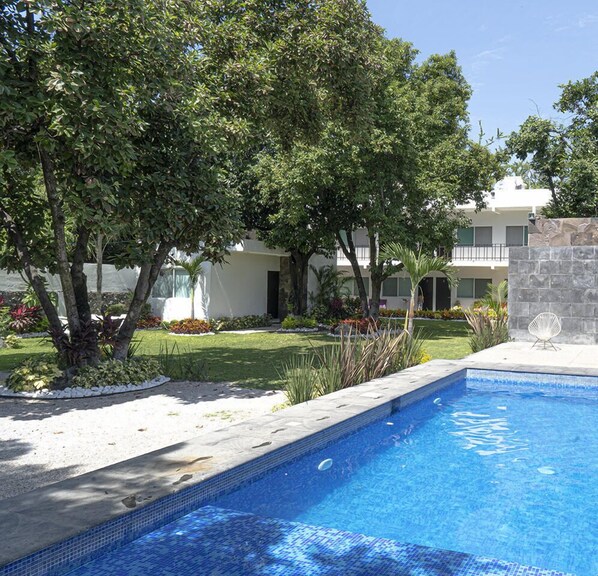 Outdoor pool, open 9:00 AM to 9:00 PM, pool umbrellas