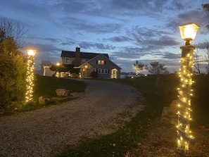Stroll through the beautifully manicured lawn to the entrance of this charming home.