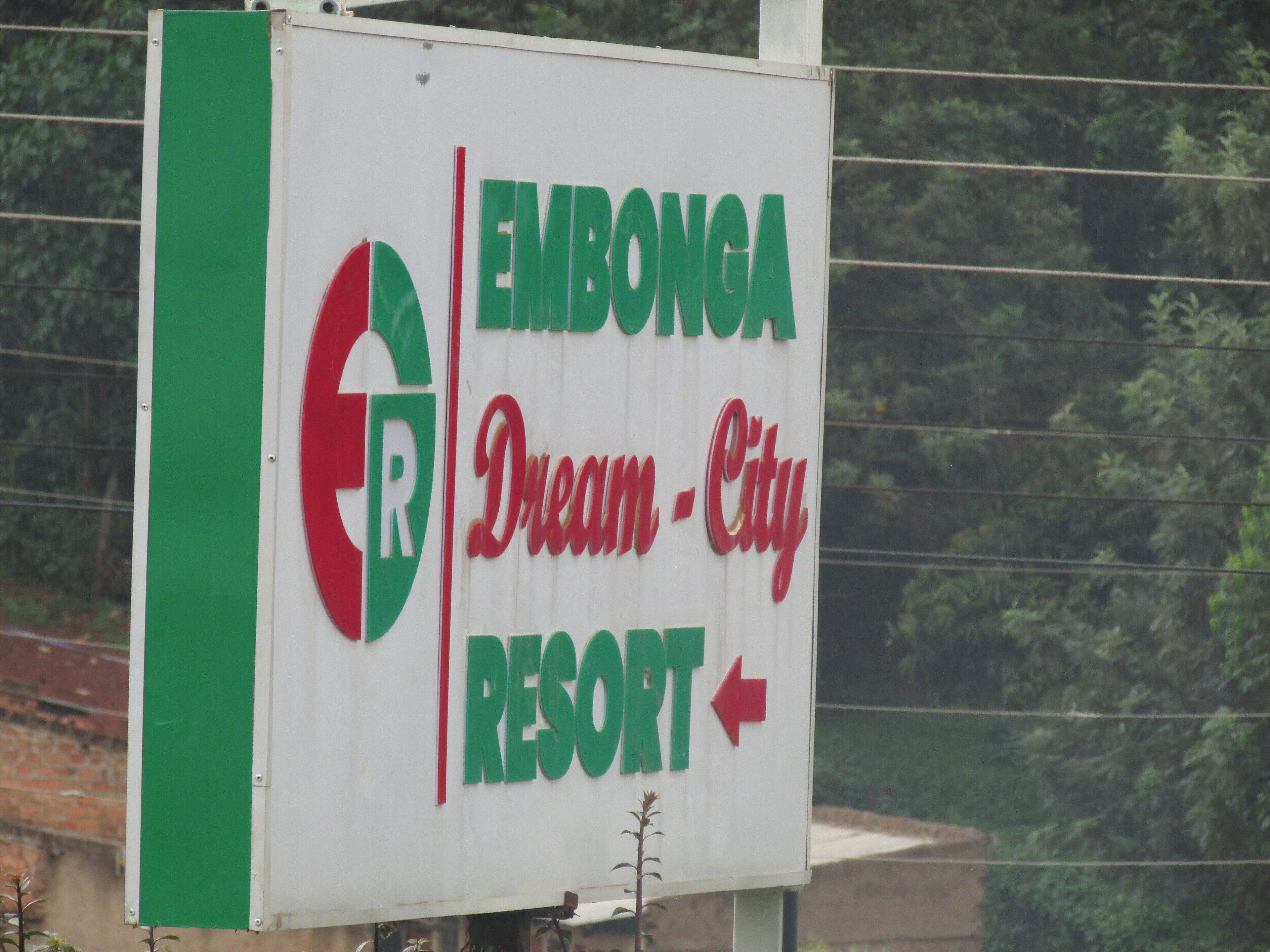 A sign for Embonga Dream City Resort with a directional arrow.
