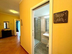 Bathtub, hair dryer, bidet, towels