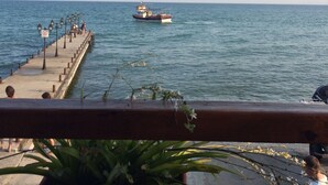 A pier extending into calm waters with a boat anchored in the distance. - 3 Bed Apt, Garden of Eden, St Vlas, Bulgaria (Sveti Vlas)