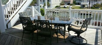 4bd Canal Front home with an Elevator, dock, fenced back yard, 2 master suites