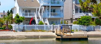 4bd Canal Front home with an Elevator, dock, fenced back yard, 2 master suites