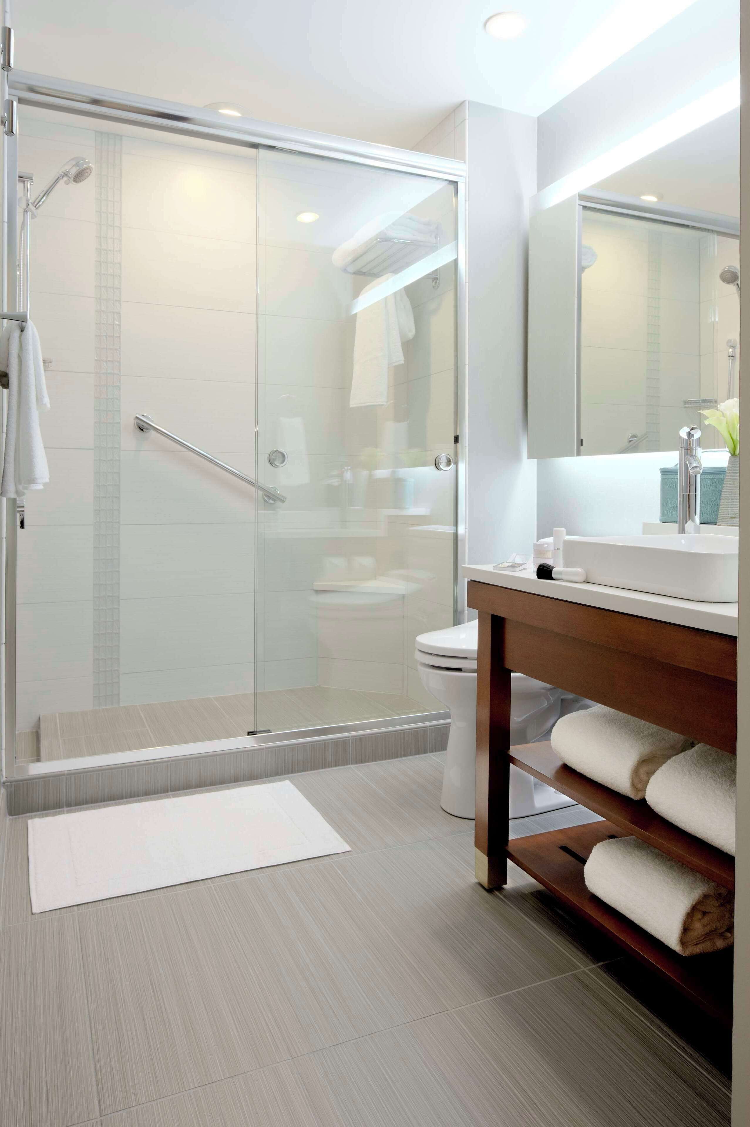 designer toiletries, hair dryer, towels