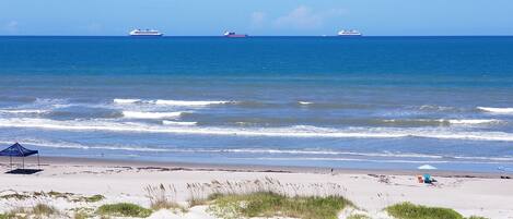On the beach, sun loungers, beach towels