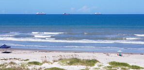 On the beach, sun loungers, beach towels