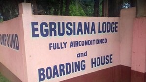 A sign for Egrusiana Lodge, indicating it is fully airconditioned and includes a boarding house. - EG Rusiana Boarding House (Claver)