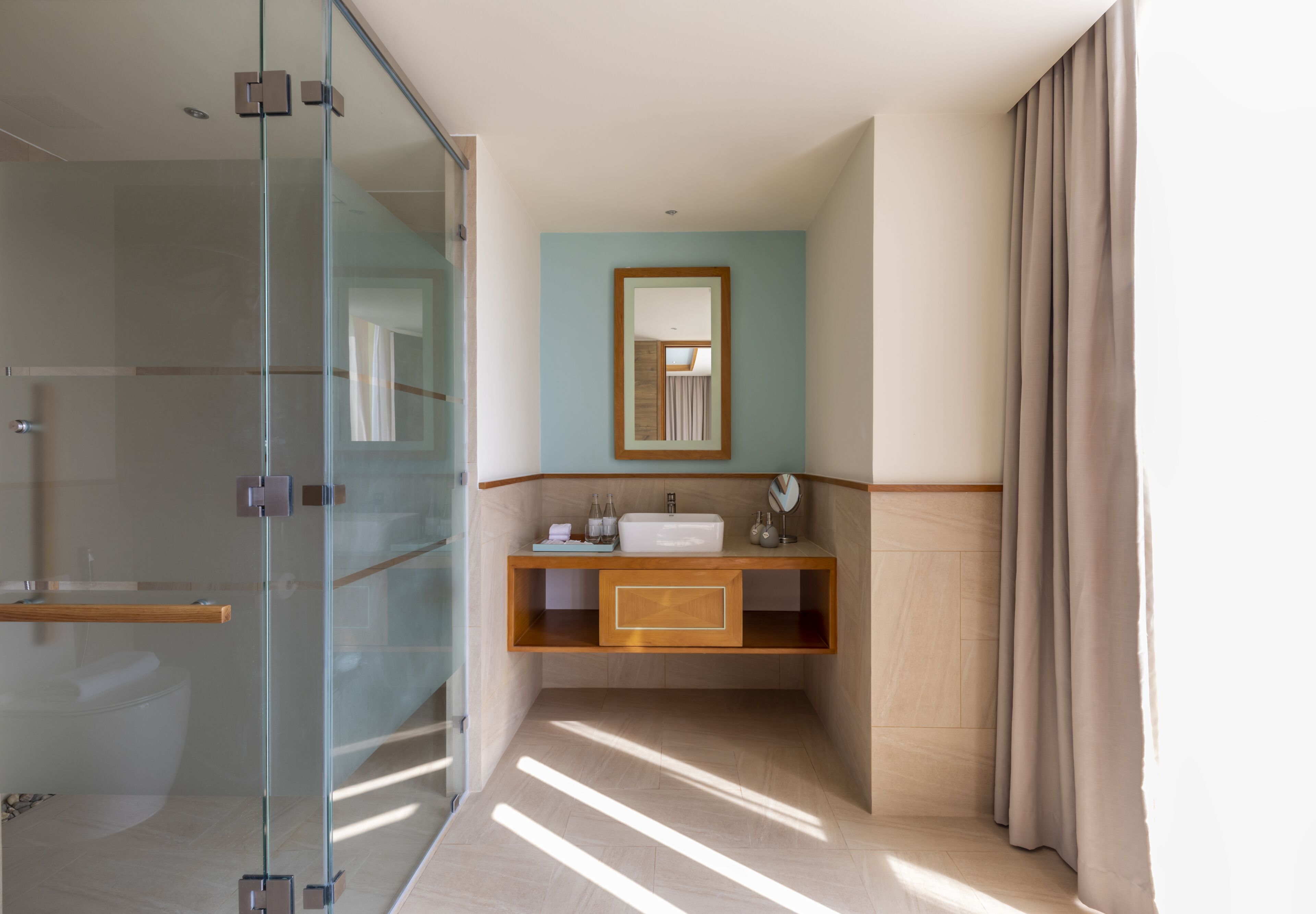 designer toiletries, hair dryer, bathrobes, slippers