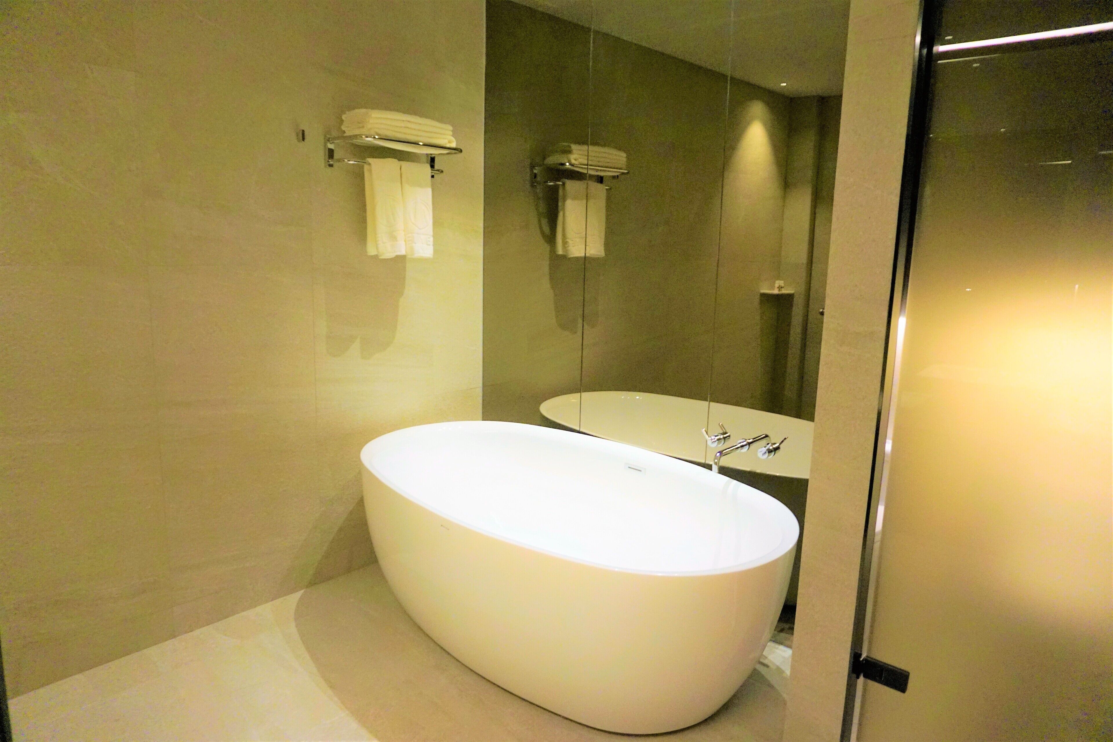 suite twin room | bathroom | separate bathtub and shower, hair dryer, dressing gowns, towels