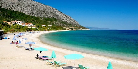 Beach nearby, white sand. Faro Del Porto