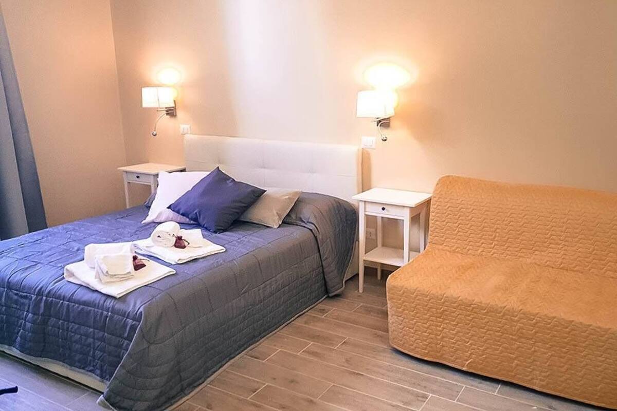 Superior Triple Room, City View (Gregorio XIII) | Minibar, in-room safe, desk, laptop workspace