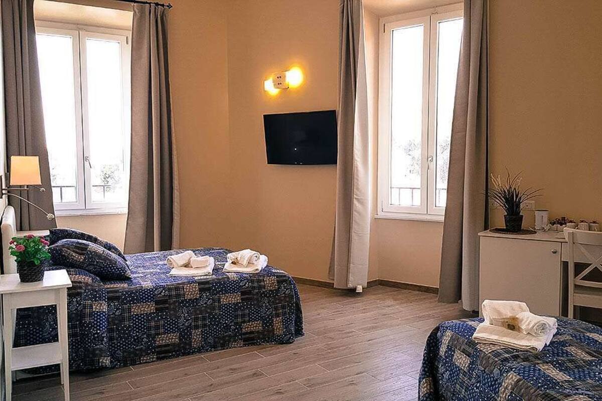 Deluxe Quadruple Room, City View (Celestino V) | Minibar, in-room safe, desk, laptop workspace