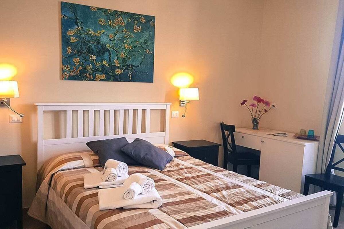 Superior Double Room, City View (Porta San Giovanni) | Minibar, in-room safe, desk, laptop workspace