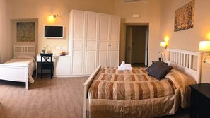 Deluxe Quadruple Room, City View (Bonifacio VIII) | Minibar, in-room safe, desk, laptop workspace