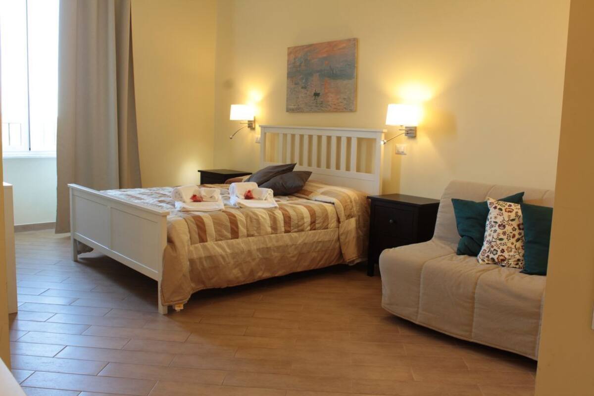Superior Triple Room, City View (Roma) | Minibar, in-room safe, desk, laptop workspace