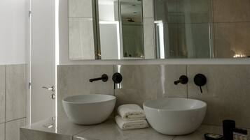 Deluxe Apartment, 2 Bedrooms | Bathroom | Shower, free toiletries, hair dryer, bathrobes