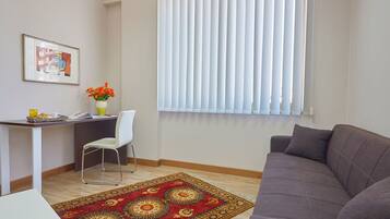 Deluxe Room (Pretoria) | Living room | Flat-screen TV