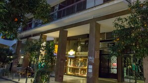 A multi-story building with balconies, some with plants. - Cozy Apartment in Syntagma - Plaka by GHH (Athens)
