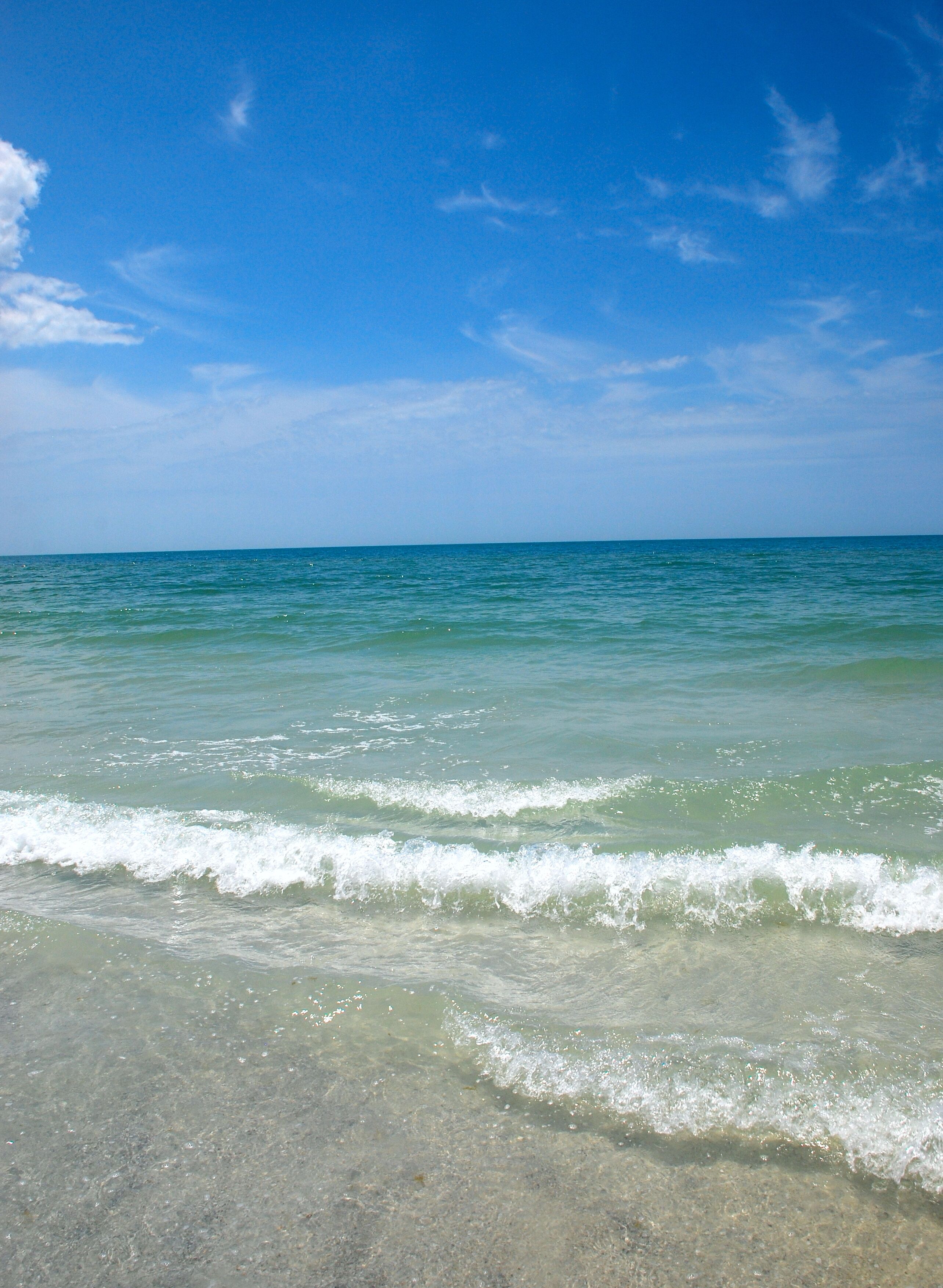 On the beach, sun loungers, beach towels