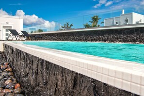 Seasonal outdoor pool, pool umbrellas, pool loungers