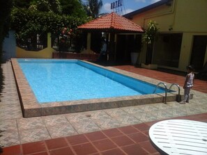 Outdoor pool, pool umbrellas, pool loungers