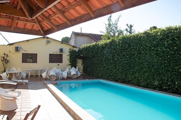 Outdoor pool, pool umbrellas, pool loungers