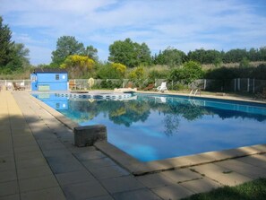 Seasonal outdoor pool, pool loungers