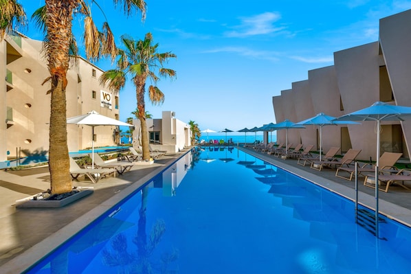 Seasonal outdoor pool, pool umbrellas, pool loungers