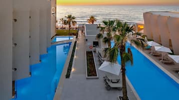 Seasonal outdoor pool, pool umbrellas, sun loungers