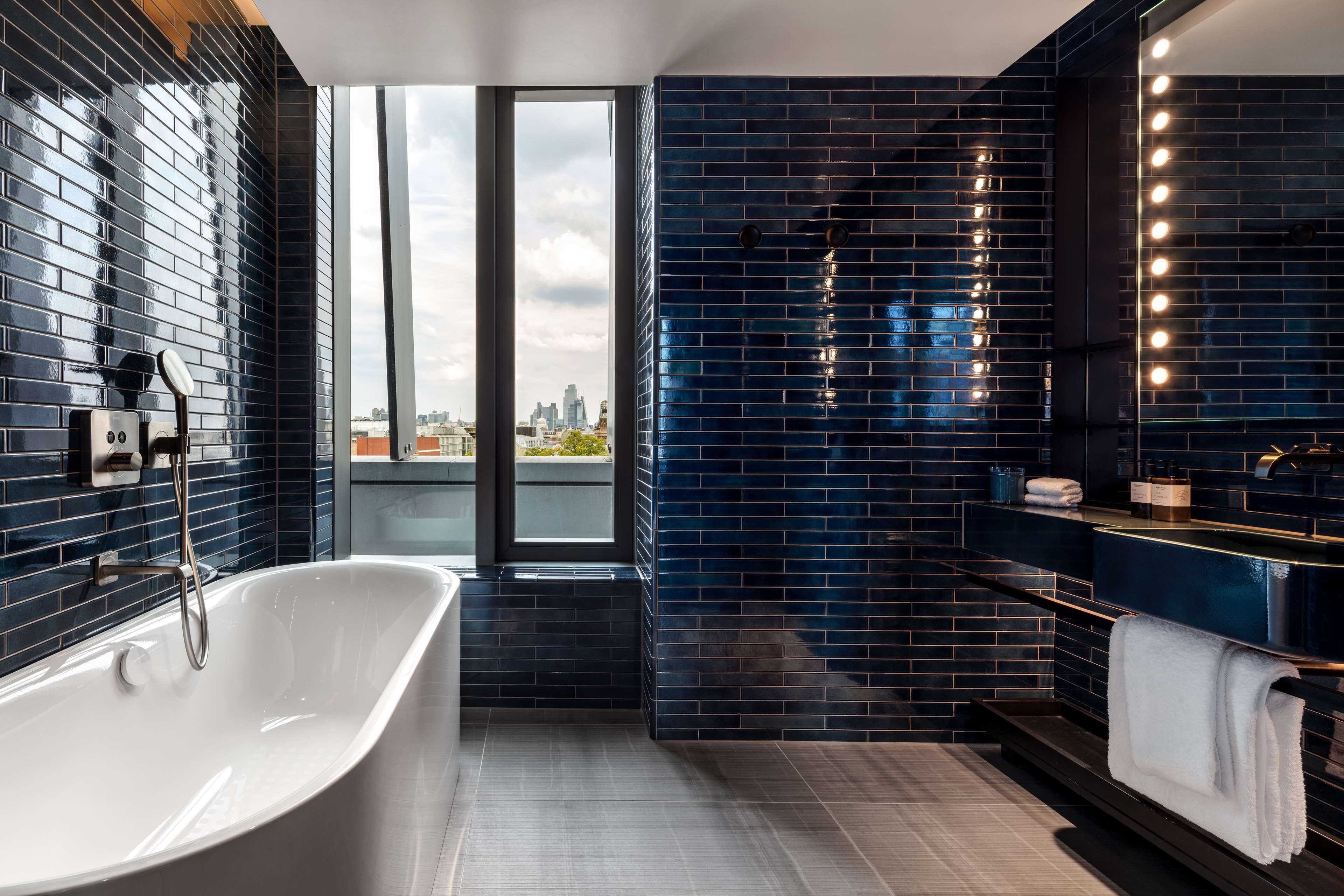 designer toiletries, hair dryer, bathrobes, slippers