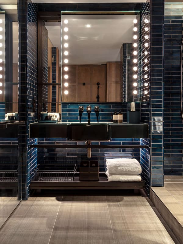 Designer toiletries, hair dryer, bathrobes, slippers