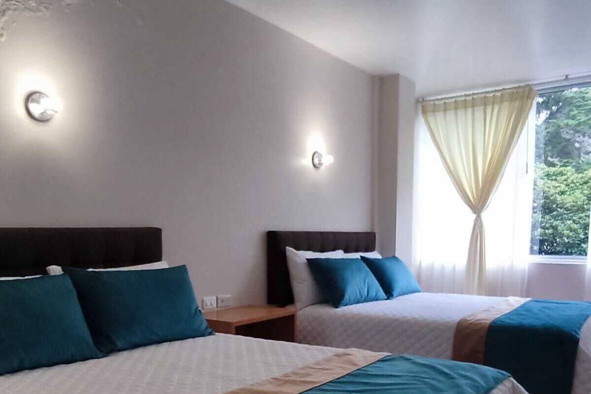 Deluxe Triple Room | Desk, laptop workspace, iron/ironing board, free WiFi