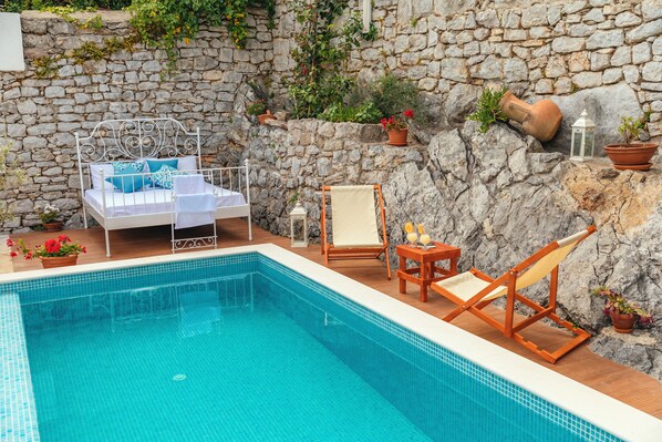 Seasonal outdoor pool, pool umbrellas, pool loungers