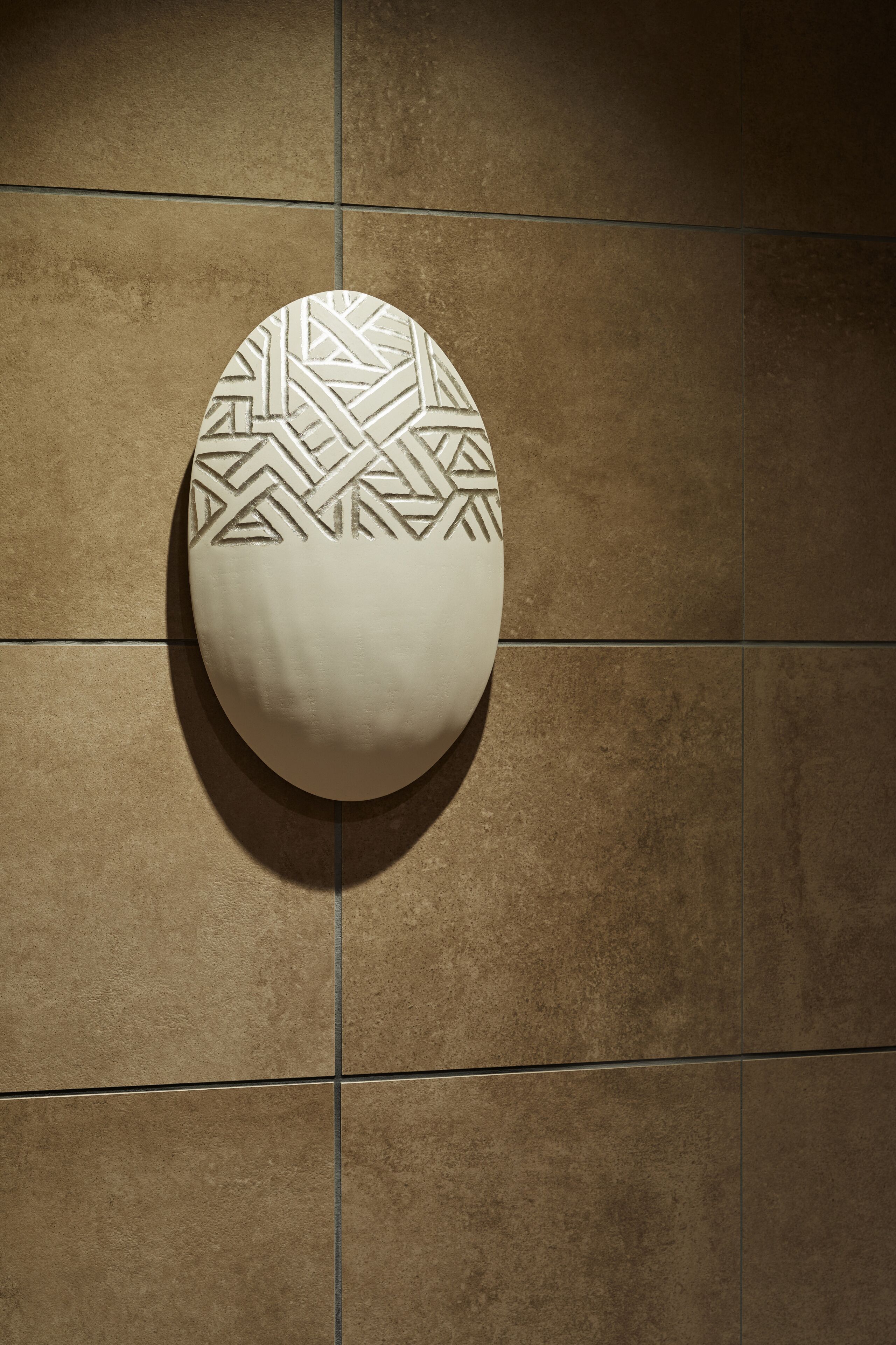 A textured wall with a geometric pattern.