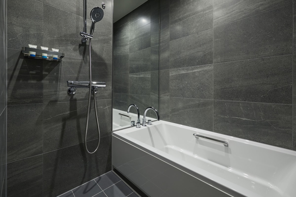 hair dryer, slippers, bidet, towels