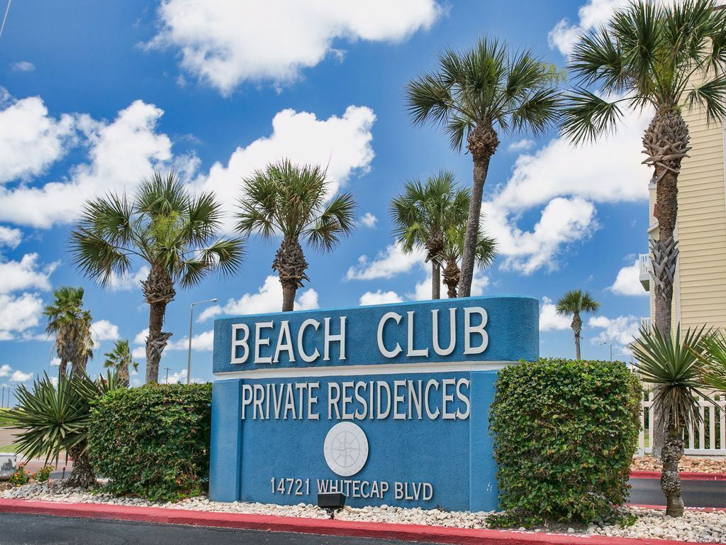 A sign for Beach Club Private Residences at 14721 Whitecap Blvd.