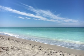 A beach with clear turquoise water and a sandy shore. - Our House at the Beach Lakeside (Siesta Key)
