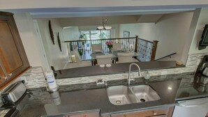 Condo, Multiple Beds (Our House at the Beach Lakeside) | Private kitchen | Oven, spices, paper towels, dining table - Our House at the Beach Lakeside (Siesta Key)