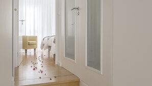 A staircase with wooden steps and white walls. - Market Place C 1BR (historical city center) (Ponta Delgada)