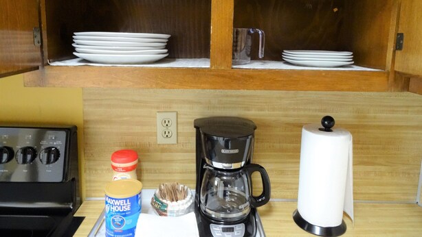 A kitchen with a coffee maker, a paper towel holder, and a microwave. - #3 UAB KING SUITE+2 MIN WALK TO RESTAURANT (Birmingham)