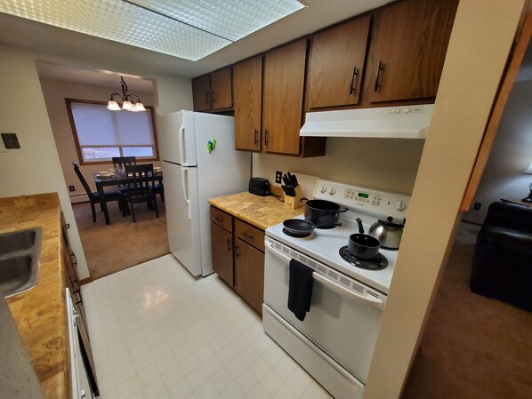 KP101APT3 - Kitchen with Stove, Oven, Dishwasher, Refrigerator/Freezer, and Kitchen Essentials