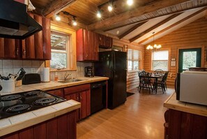 Fridge, microwave, oven, stovetop - Creekside Cabin with covered porch only 3 miles from downtown Bryson City! (Bryson City)