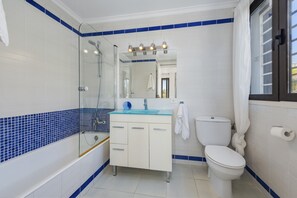 Bathtub, hair dryer, towels