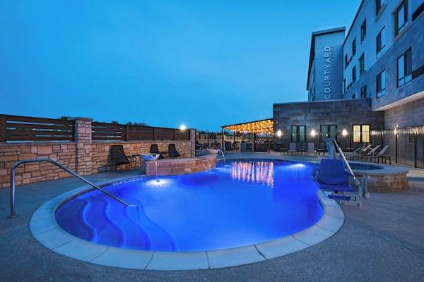 Outdoor pool, open 7:00 AM to 10:00 PM, pool umbrellas, sun loungers