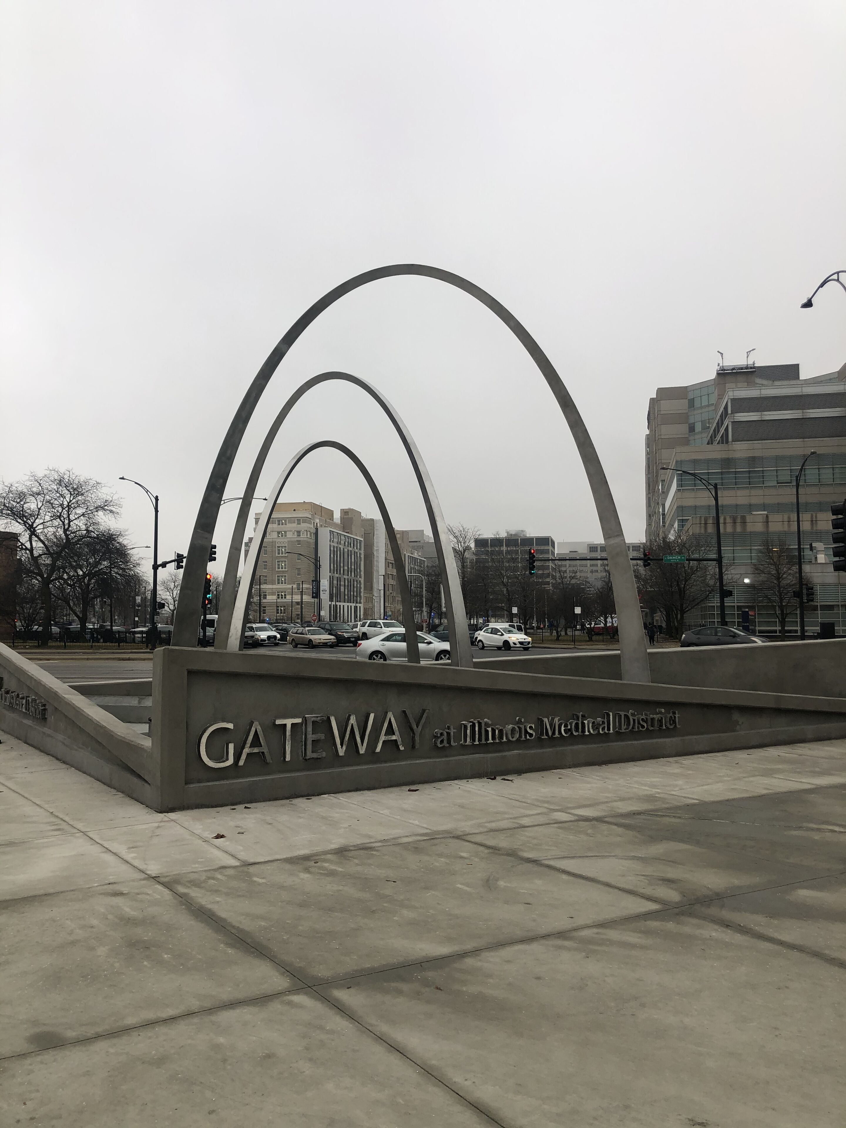 A modern architectural structure with the inscription "GATEWAY at Illinois Medical District."