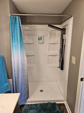 Bathtub, hair dryer, towels, soap