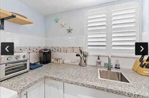 Microwave, coffee/tea maker, toaster, cookware/dishes/utensils